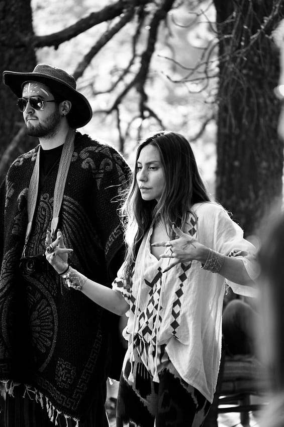 pexels-photo-20862276-20862276 A stylish couple in bohemian attire captured in black and white outdoors.